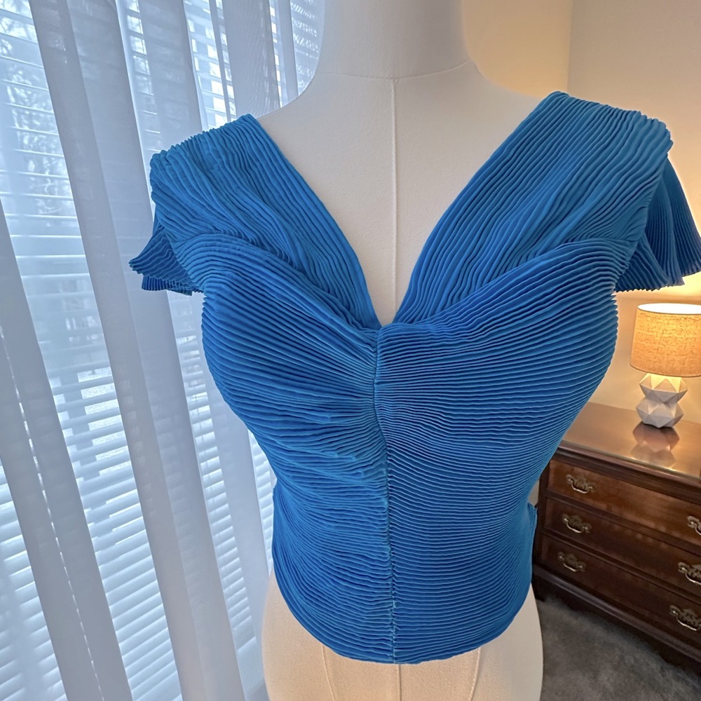 Express pleated top with flared cap sleeve